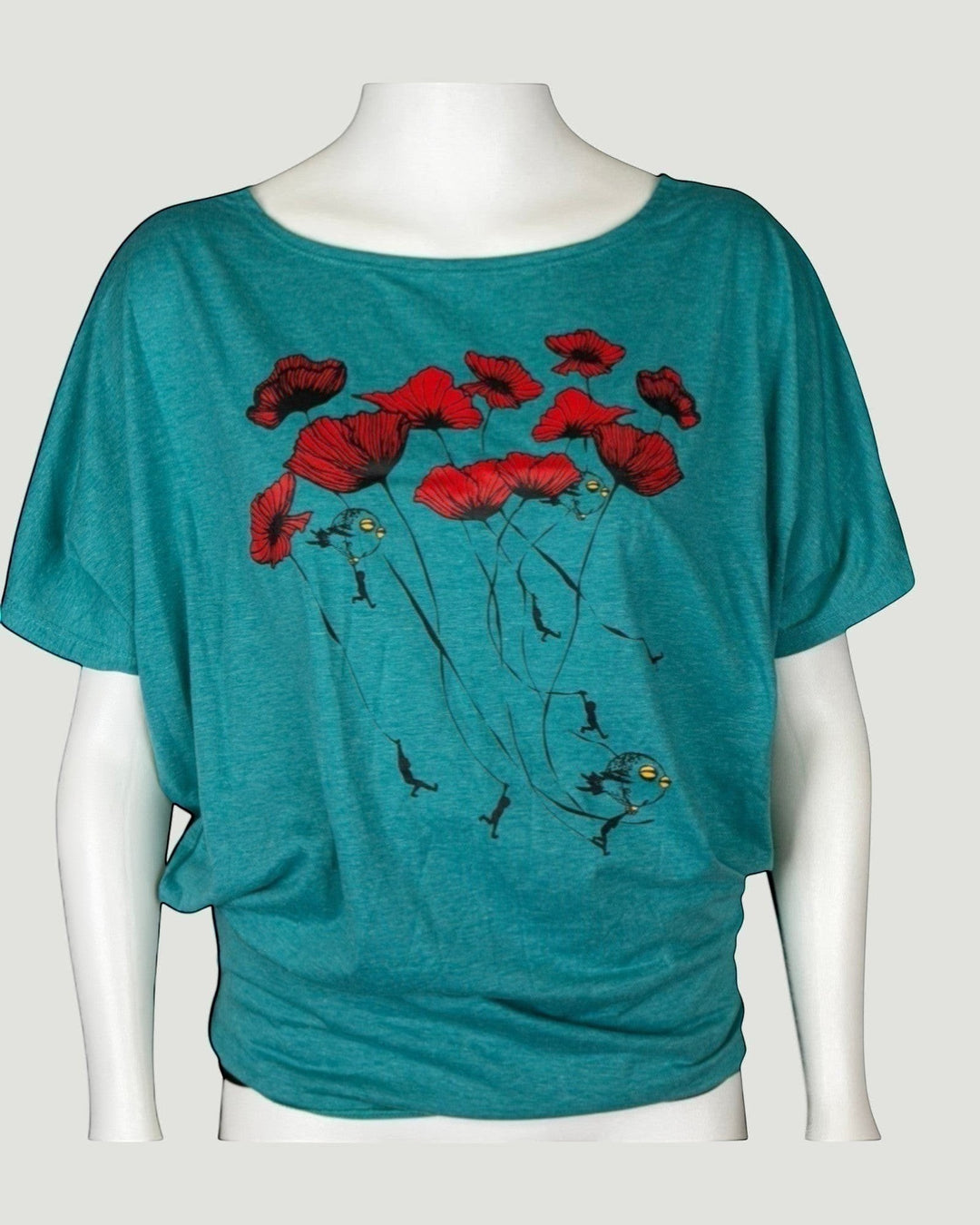 ULA 'Hot' Batwing Top in Aqua Sea. Features a playful print of red poppies with dangling figures and a bird. Relaxed fit, comfortable fabric.