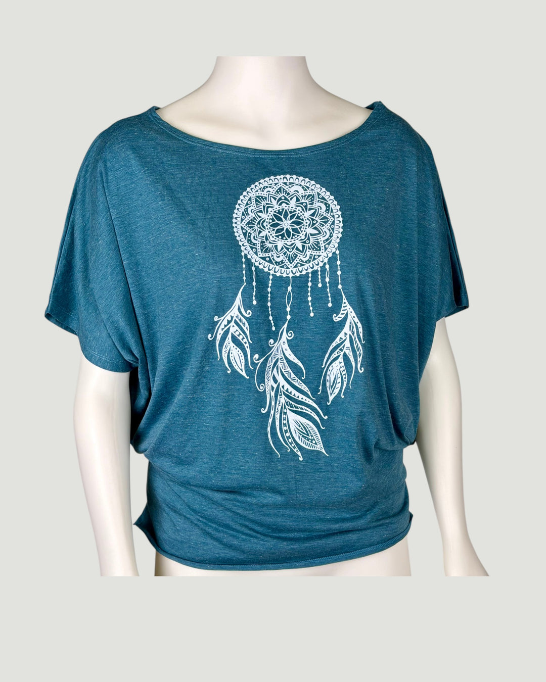ULA turquoise batwing top with white dreamcatcher and feather print. Soft, flowing fabric.